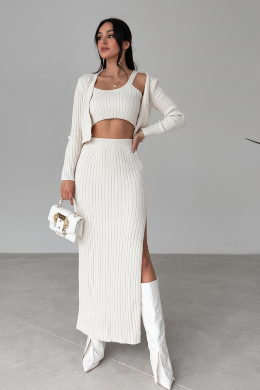 Woman wearing a white outfit with a gray background